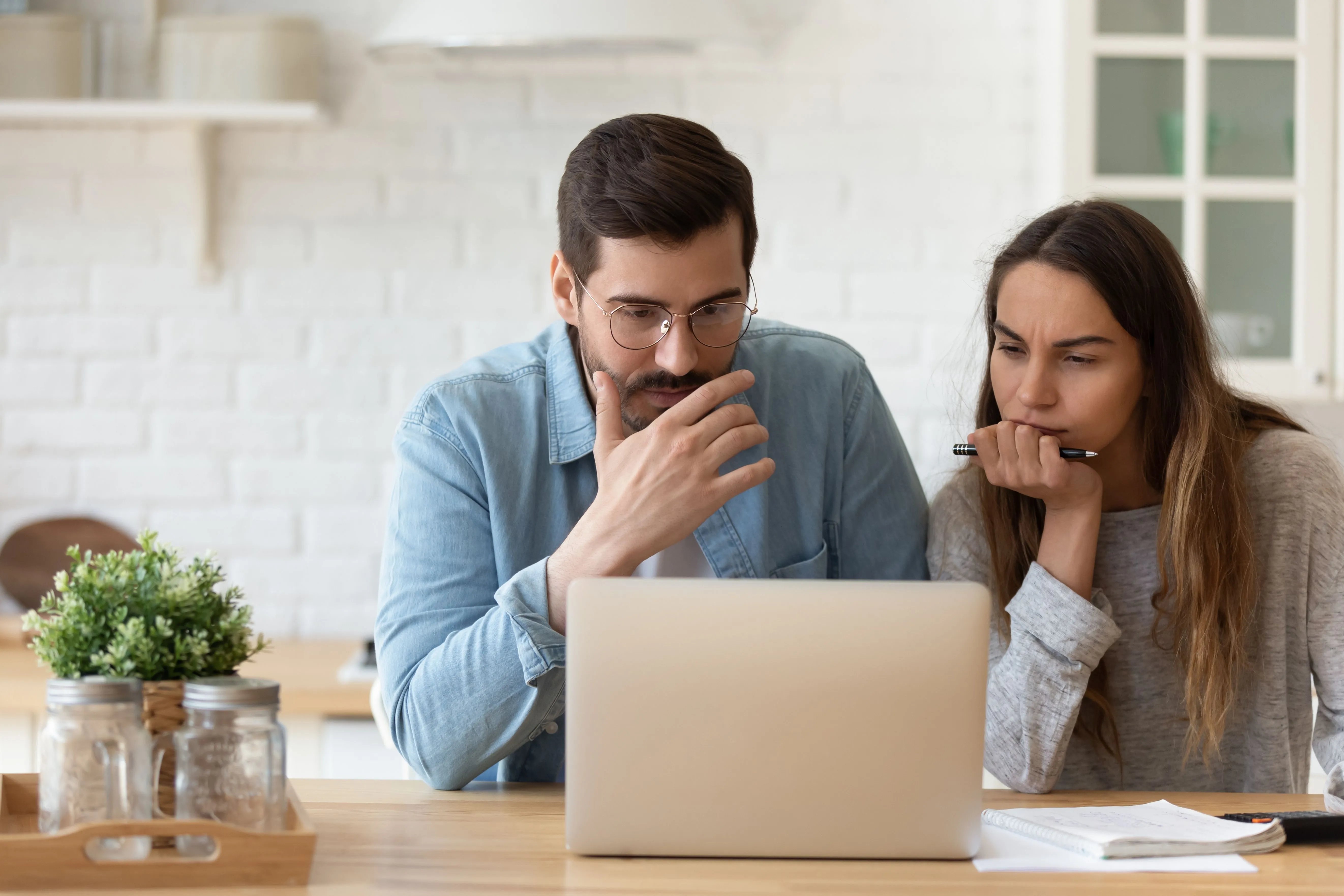 couple developing strategy on computer