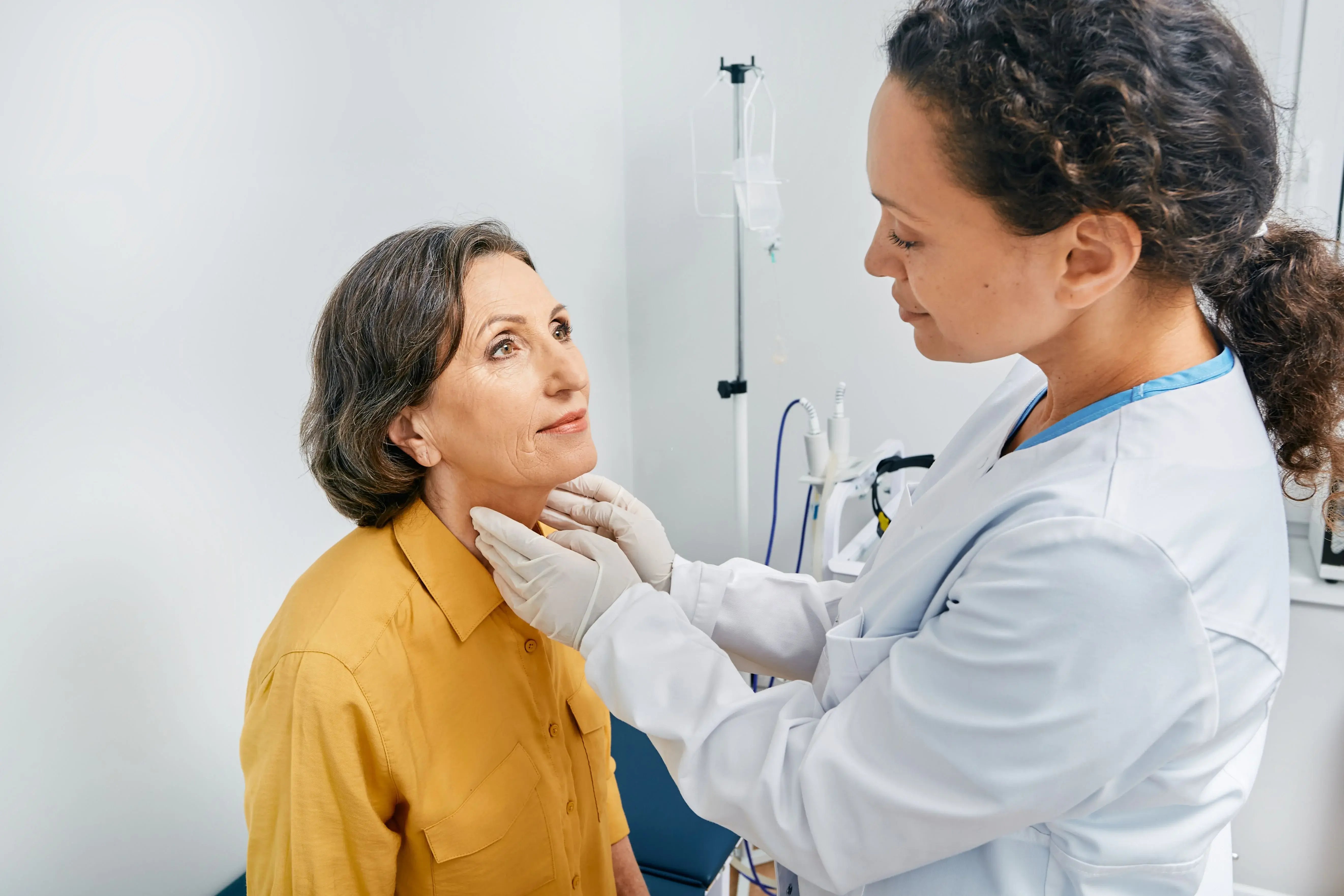 woman having physical checkup with doctor