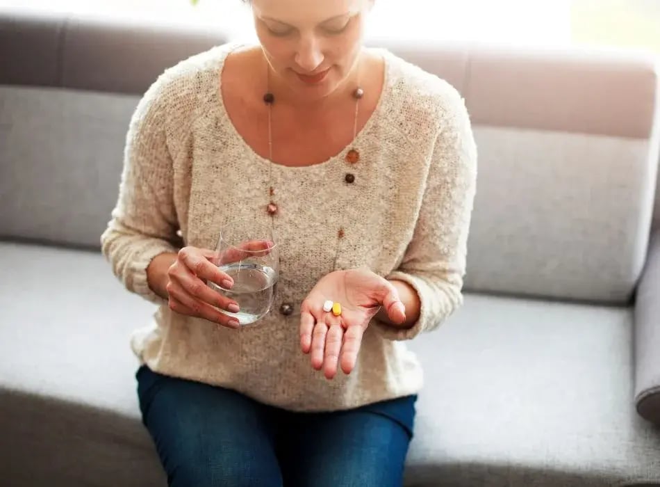 woman taking medicine