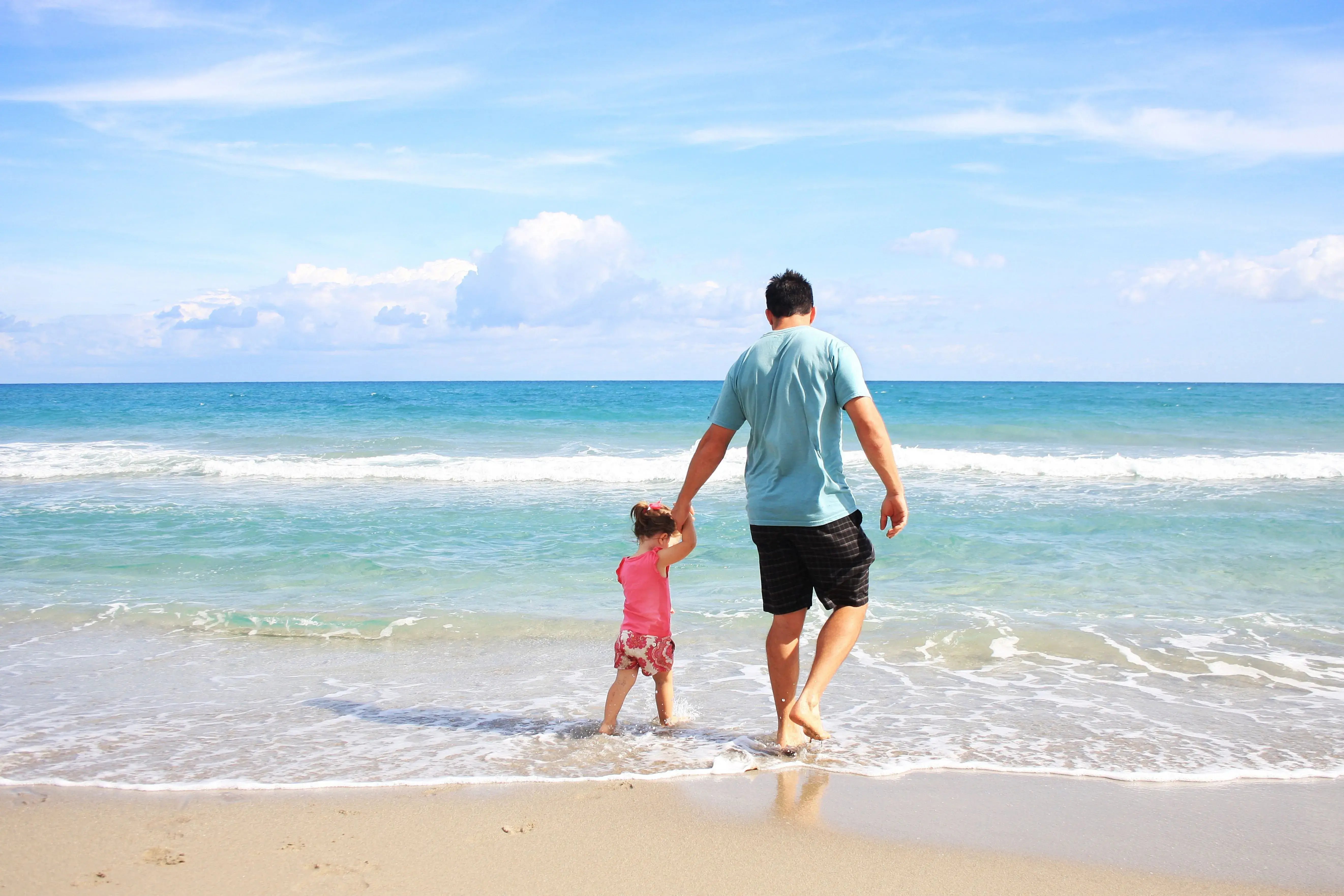 dad and child at beach