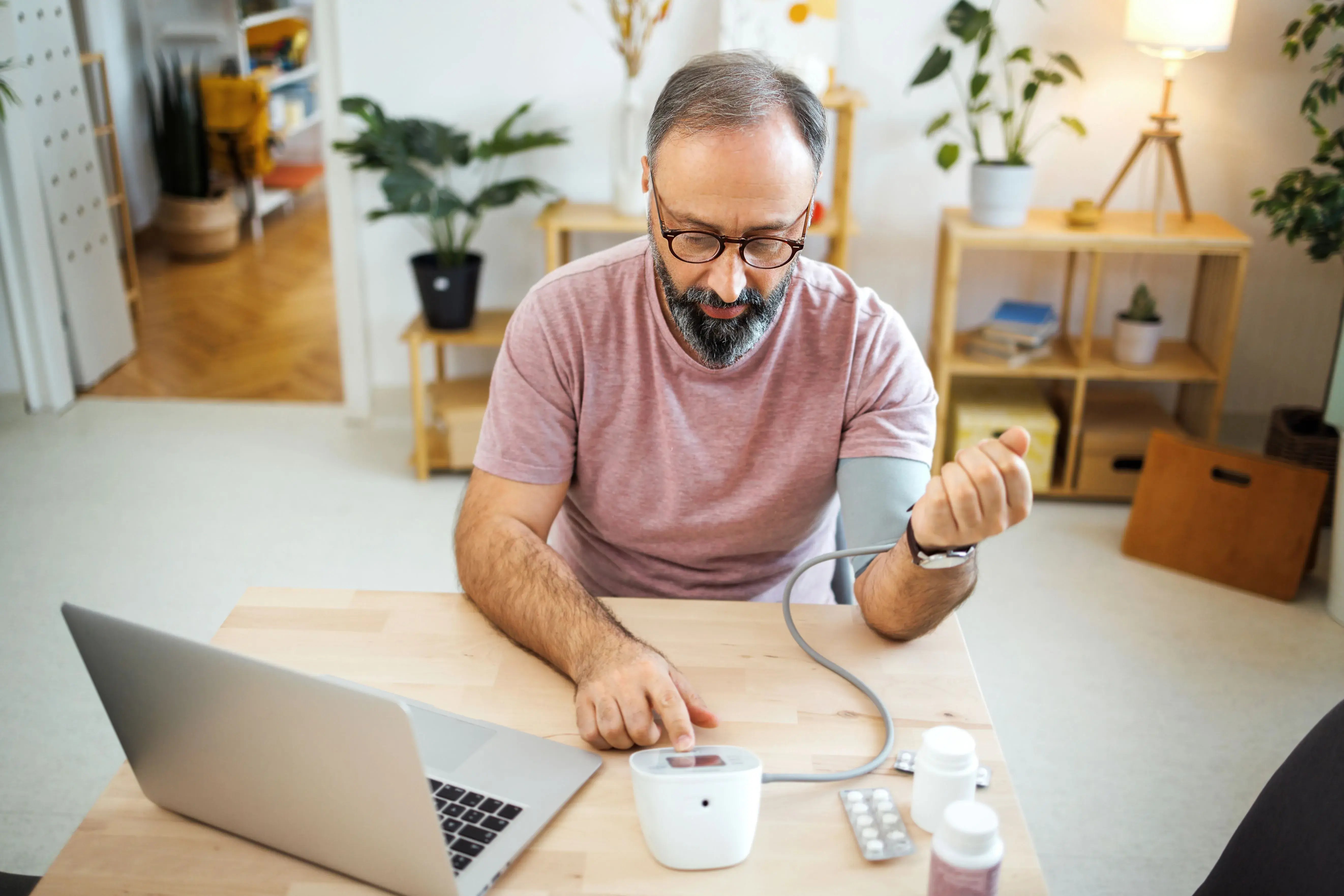 man taking blood pressure for televisit