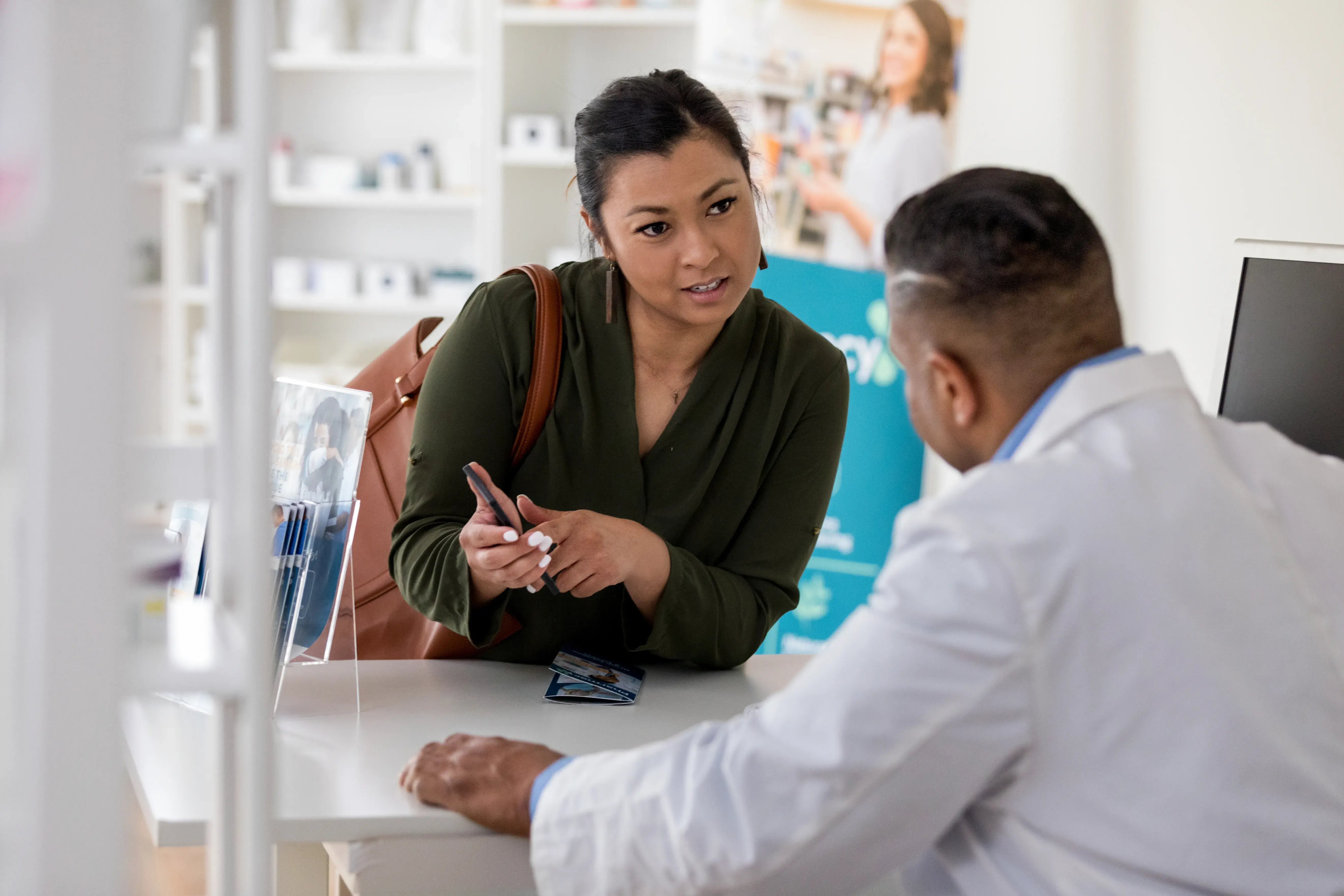 woman talking to pharmacist