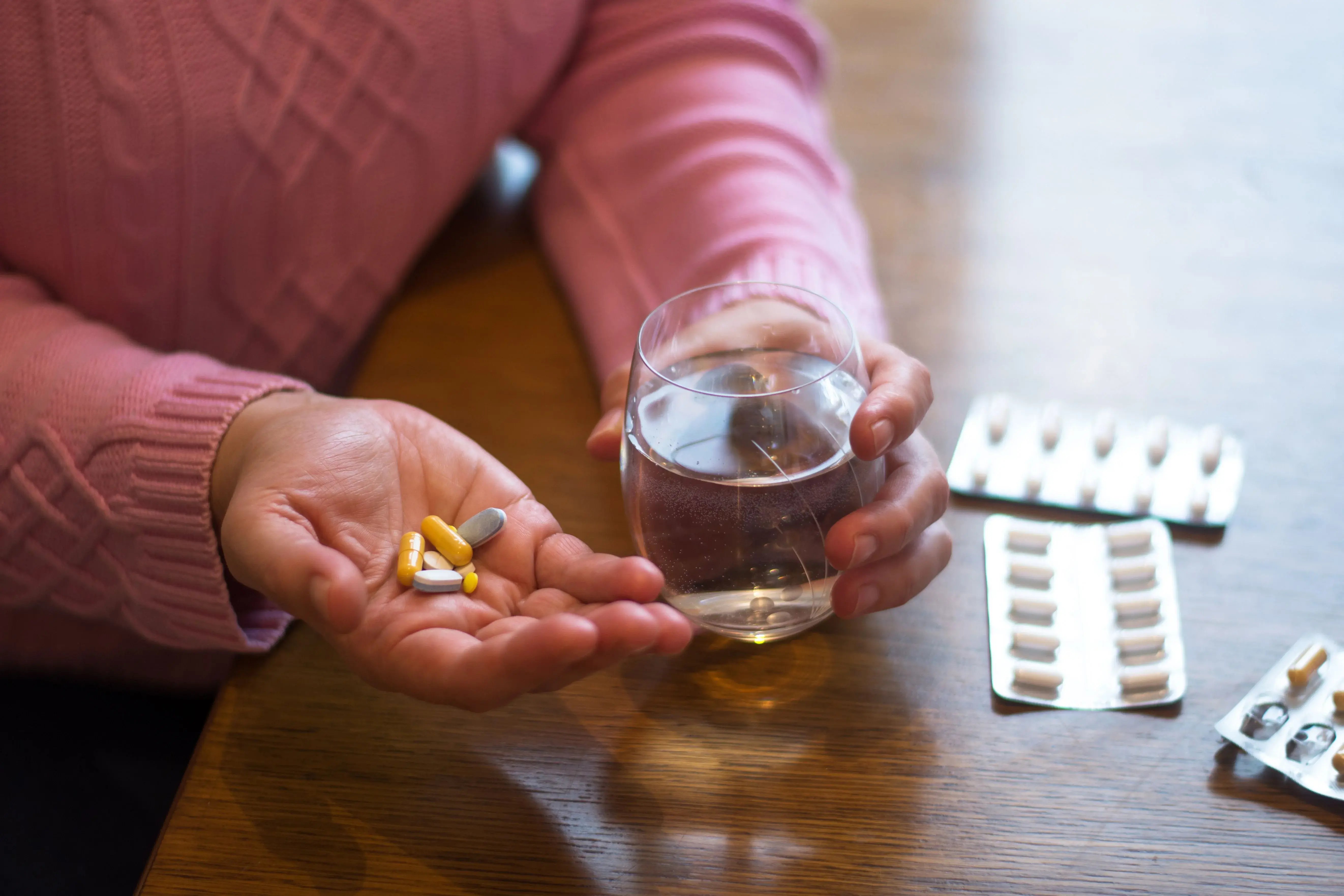 female taking medicine