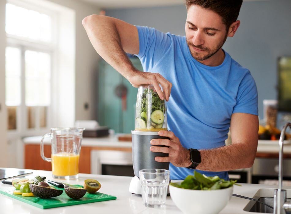 man making healthy smoothie