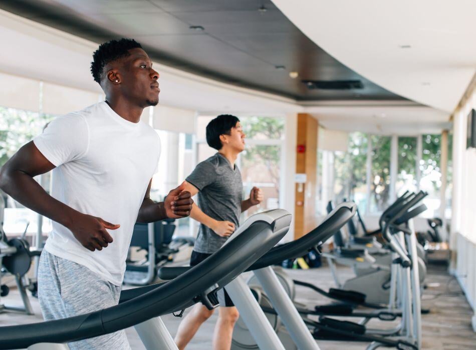 men on treadmill at gym