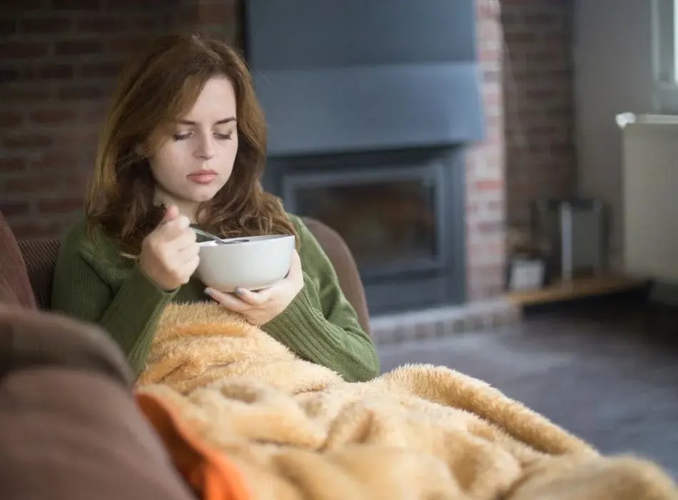 woman having hot soup