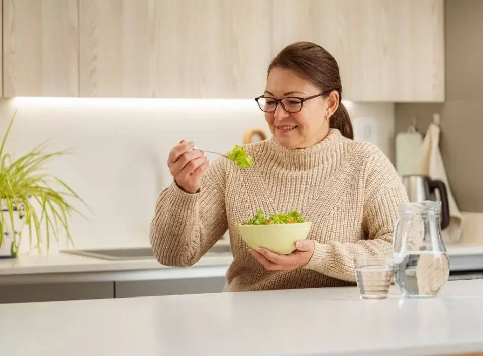 woman eating salad